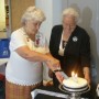 35yrcake Celtic Council Convenor Margaret Sharpe, of the Manx Society of NSW, (L) cuts the 35 yr cake (with Jennifer Meston)